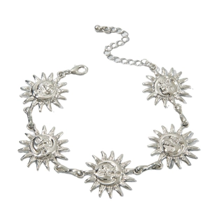 Vintage silver sun and moon medallion anklet with adjustable lobster clasp on white background