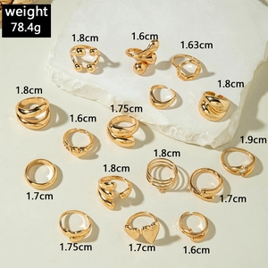 Detail of 15-piece gold ring set with heart and spiral shapes weighing 78.4g