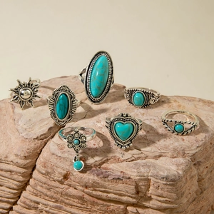 Bohemian 7-piece vintage silver ring set with turquoise stones and sunflower motifs