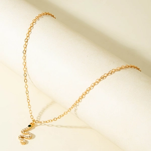 Gold long chain Y-necklace with crystal-encrusted snake pendant and green stone eye