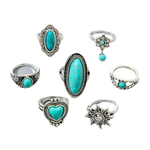 7-piece bohemian vintage turquoise ring set with silver floral and sun motif patterns