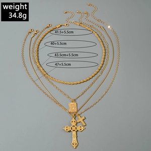 Detailed size chart of vintage gold layered cross necklaces with weights and lengths