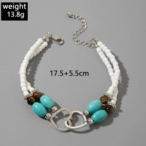Double-layered beaded bracelet with interlocking silver hearts and turquoise stones, 13.8g