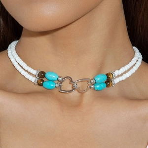 Detail of bohemian double-layer choker with white seed beads and turquoise heart charm