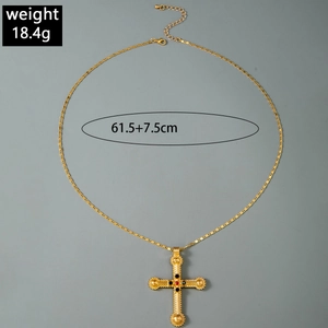 Detail view of gold vintage cross pendant necklace showing 18.4g weight and 61.5cm length