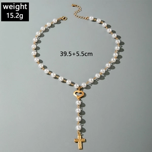 Detail view of gold cross pendant pearl necklace with weight and length measurements