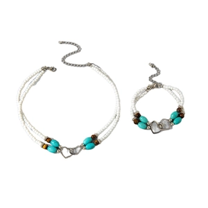 Bohemian seed bead turquoise jewelry set with silver interlocking heart pendants