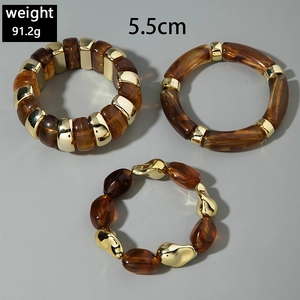 Detailed view of amber resin and gold metal chunky beaded bracelet set with dimensions