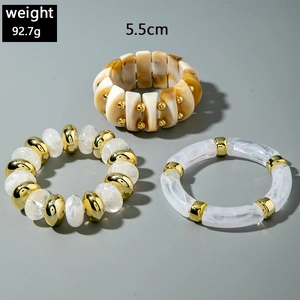 Chunky acrylic bead bracelets set in marble and resin with gold metal accents