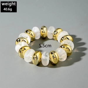 Detail view of 5.5cm beaded bracelet featuring gold metal and white marble acrylic beads