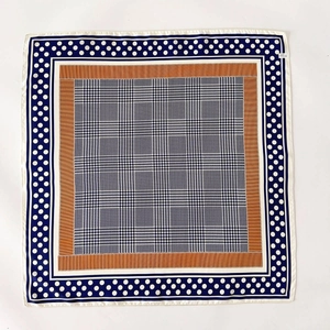 Classic square silk scarf with navy houndstooth pattern and polka dot border detail