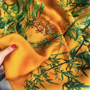 Elegant yellow silk scarf with traditional bamboo and plum blossom print for women