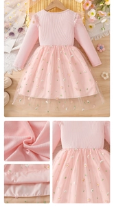 Detail of pink girls knit dress with daisy embroidery on layered tulle skirt