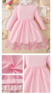 Close-up of pink knit fabric and glitter bow prints on a girls tutu princess dress