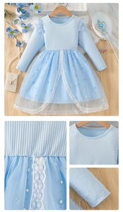 Detailed close-up of light blue princess dress with sequined mesh and lace stitching