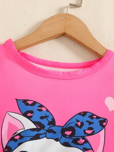 Hot pink baby girl t-shirt with cute cartoon leopard print bow on a wooden hanger