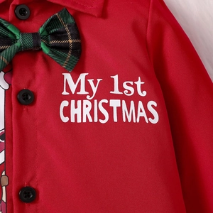 Detail of Christmas baby romper with My 1st Christmas print and green plaid bowtie