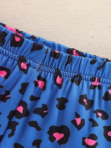 Blue toddler shorts featuring pink leopard print with a comfortable elastic waistband