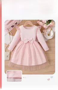 Detail of pink long-sleeve dress with ribbed cotton bodice and sparkly star tulle skirt