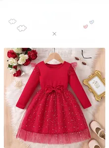 Flat lay of a red princess dress for girls with star sequins and bow details