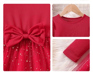 Detail of red girls dress with large waist bow and sparkling gold star mesh skirt