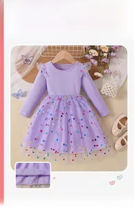 Detail of lavender girls' long sleeve princess dress with mesh layers and polka dots