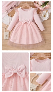 Detail of light pink girls' princess dress featuring a large waist bow and sequin tulle skirt
