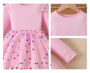 Detail showing pink knitted bodice and layered tulle skirt with colorful sequins