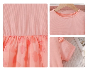 Detail view of pink tulle skirt with elastic ribbed bodice and delicate neck stitching