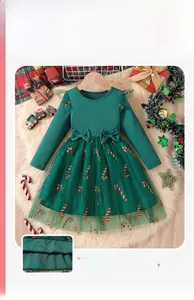Detail of green long sleeve dress for girls with mesh tulle skirt and Christmas candy cane print