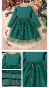 Detail of girls long sleeve green Christmas dress with candy cane print mesh skirt