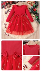 Detail of red Christmas dress for girls featuring mesh tutu skirt and candy cane prints