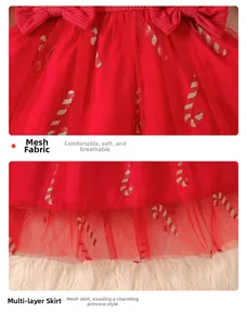 Detail of red Christmas dress with mesh layers and glitter candy cane prints