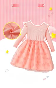 Detail of pink long-sleeve dress with soft ribbed fabric and layered mesh tulle skirt