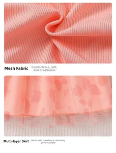 Detail of pink knit fabric paired with multi-layer heart print mesh for toddler dress