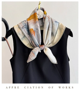 Detail of silk wool scarf showing elegant landscape painting pattern tied on black top