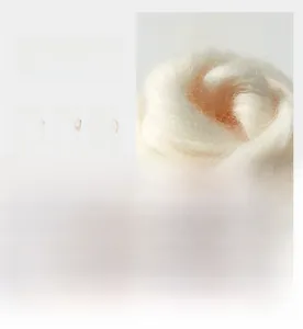 Macro detail of high-quality wool and silk blend fabric showing texture and luster