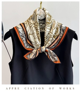 Detail of vintage rose print silk wool scarf tied on a black dress neck accessory