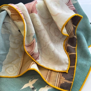 Elegant crane and cloud print silk scarf with fine twill texture and yellow rolled edges