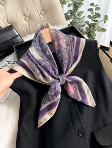 Detail of 70cm paisley imitation silk chiffon square scarf tied on black vest