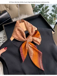 Detail of 70x70cm paisley chiffon silk scarf tied on hanger with orange and red tones