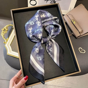 Silk scarf with vintage carriage print and gradient borders in a bow shape