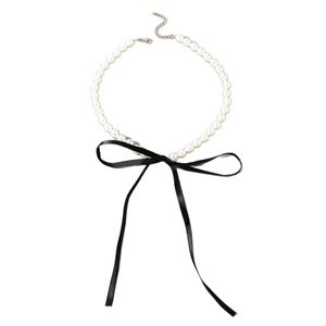 Elegant French style pearl necklace featuring a black velvet bow and adjustable lobster clasp