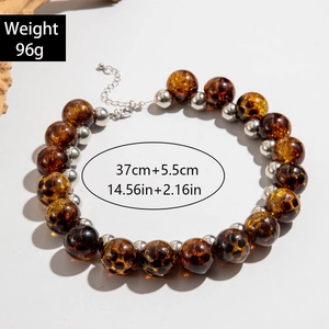 Detail of tortoiseshell bead necklace with silver spacers and size specs at 96g