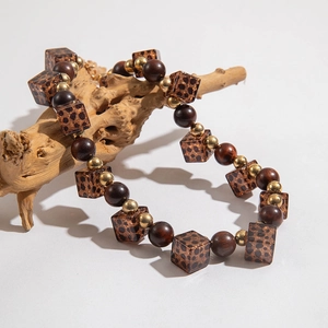 Bohemian choker necklace with leopard print square beads and vintage brown wooden accents