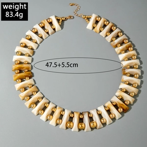 Detail of irregular necklace with amber texture pieces, golden beads, 47.5cm length