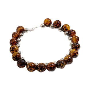Irregular beaded necklace with amber tortoiseshell beads and silver metal accents