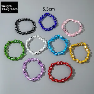 Detail view of colorful bohemian evil eye beaded elastic bracelets in nine vibrant colors