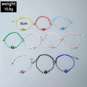 Detailed view of ten colorful braided evil eye bracelets with adjustable knots