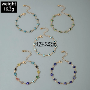 Detail of 5-piece Evil Eye beaded bracelet set with gold finish and lobster clasp detail